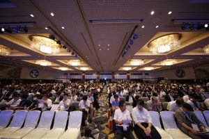 Participants wait for presentations to begin at at the Rakuten Fintech Conference 2016.