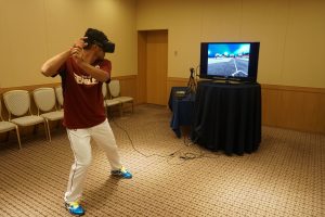 Rakuten Eagles player Toshiaki Imae tries out the virtual reality Baseball batting coaching system