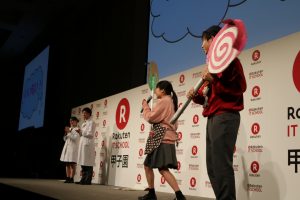 Promoting the "tongue cleaner" on stage.