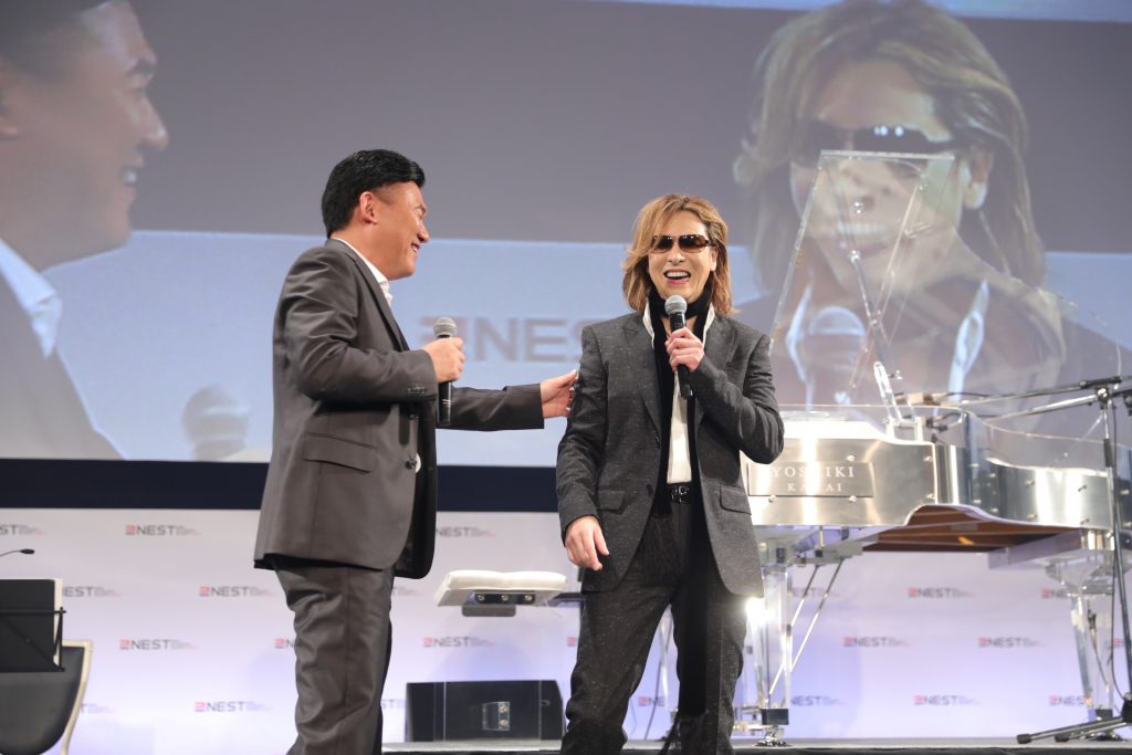 "Behind each genius there's a lot of painstaking effort and hard work," Mickey Mikitani explained in reference to Yoshiki.