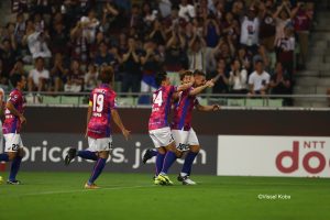 Podolski celebrates a goal with Vissel Kobe teammates in his debut J.League match for the team