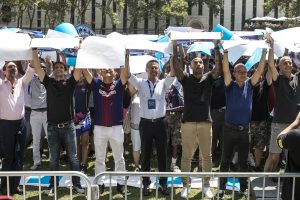 Rakuten CEO Hiroshi "Mickey" Mikitani and FC Barcelona VIP guests help create the largest human soccer jersey ever.