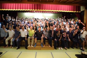 Rakuten executives celebrate after the Mt Tanigawa climb.