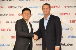 Rakuten CEO Hiroshi “Mickey” Mikitani and Walmart CEO Doug McMillon shaking hands at a press conference announcing the formation of a strategic alliance between Rakuten and Walmart in Tokyo, Japan.