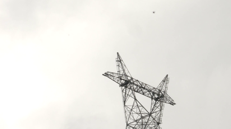 Rakuten’s drone flying above a TEPCO tower in Chichibu, Saitama.