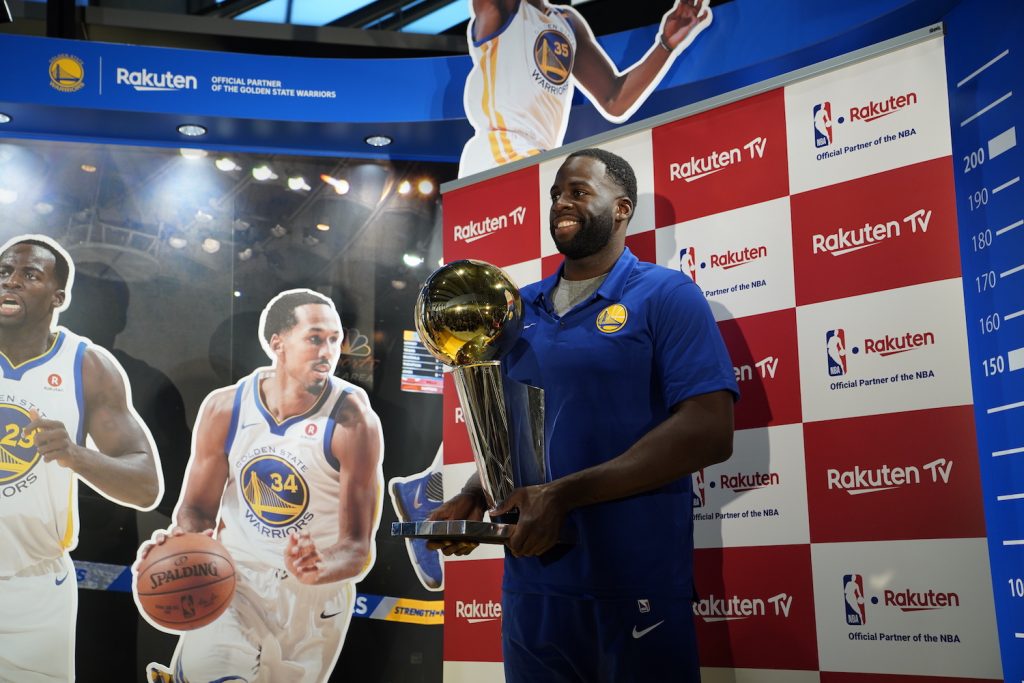 Draymond Green poses for media with the 2018 NBA Championship Trophy.