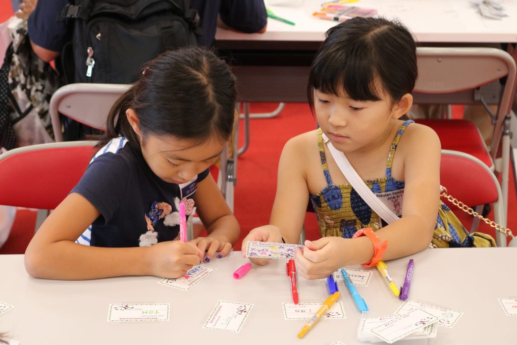 Two budding businesskids make their first business cards.