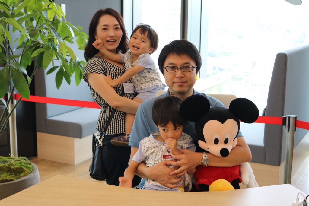 Yukie (left) and family pose with “Mickey”