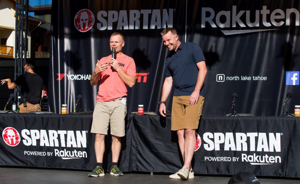 Spartan Founder & CEO Joe De Sena (left) and Rakuten Marketing CEO Stuart Simms on stage at a press conference before the Spartan World Championship in Tahoe, California.