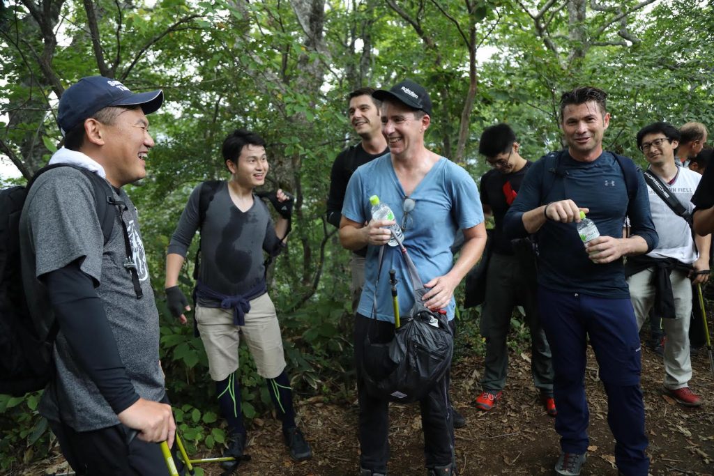 Tareq Amin, CTO of Rakuten's new mobile venture (front right) sharing a laugh with Rakuten executives and Mickey (far left)