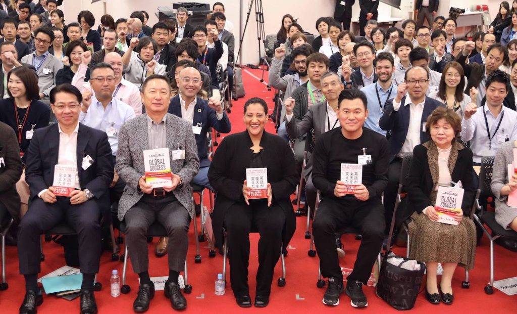 Neeley with Rakuten executives, employees and special guests at Rakuten Crimson House in Tokyo.
