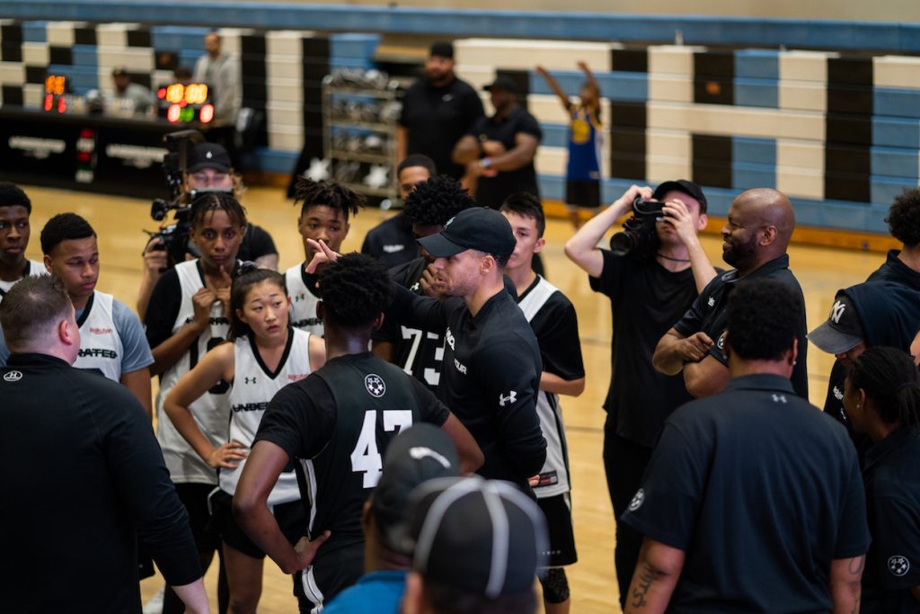 Stephen Curry offers words of encouragement to athletes during the opening stop of the Underrated Tour Powered by Rakuten in Los Angeles.