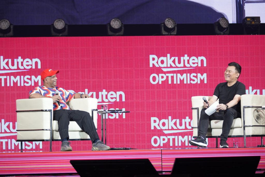 Longtime friends Tony Fernandes and Mickey Mikitani share a laugh on stage at Rakuten Optimism.