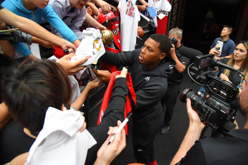 Fans reach for a lucky autograph from Raptors’ four-time NBA All-Star Kyle Lowry.