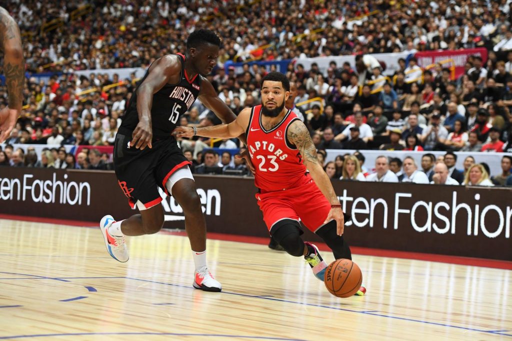 Raptors point guard Fred VanVleet maneuvers around Rockets center Clint Capela.